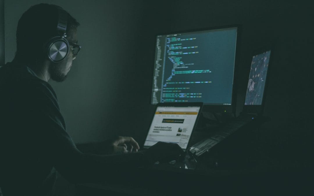 photo of a man staring at a computer